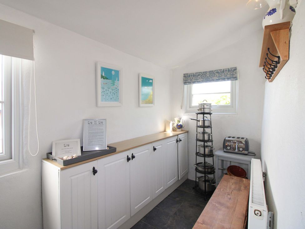 A kitchen with cupboard and toaster at 3 Rock Cottages Kingston