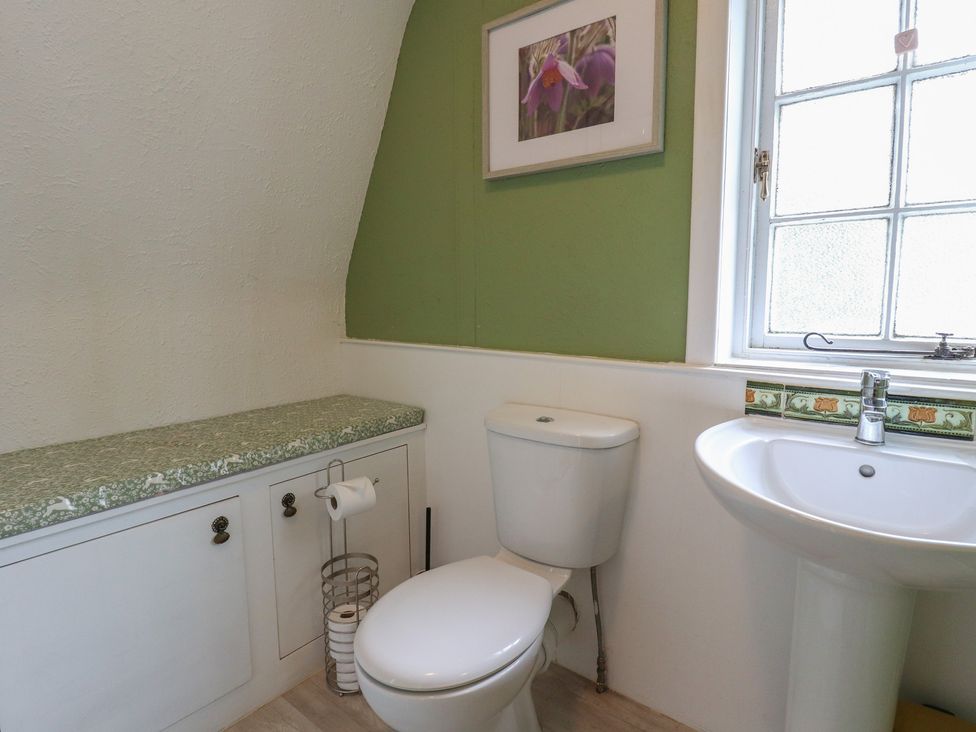 A bathroom with a toilet and sink at Branklyn Garden Cottage in Perth