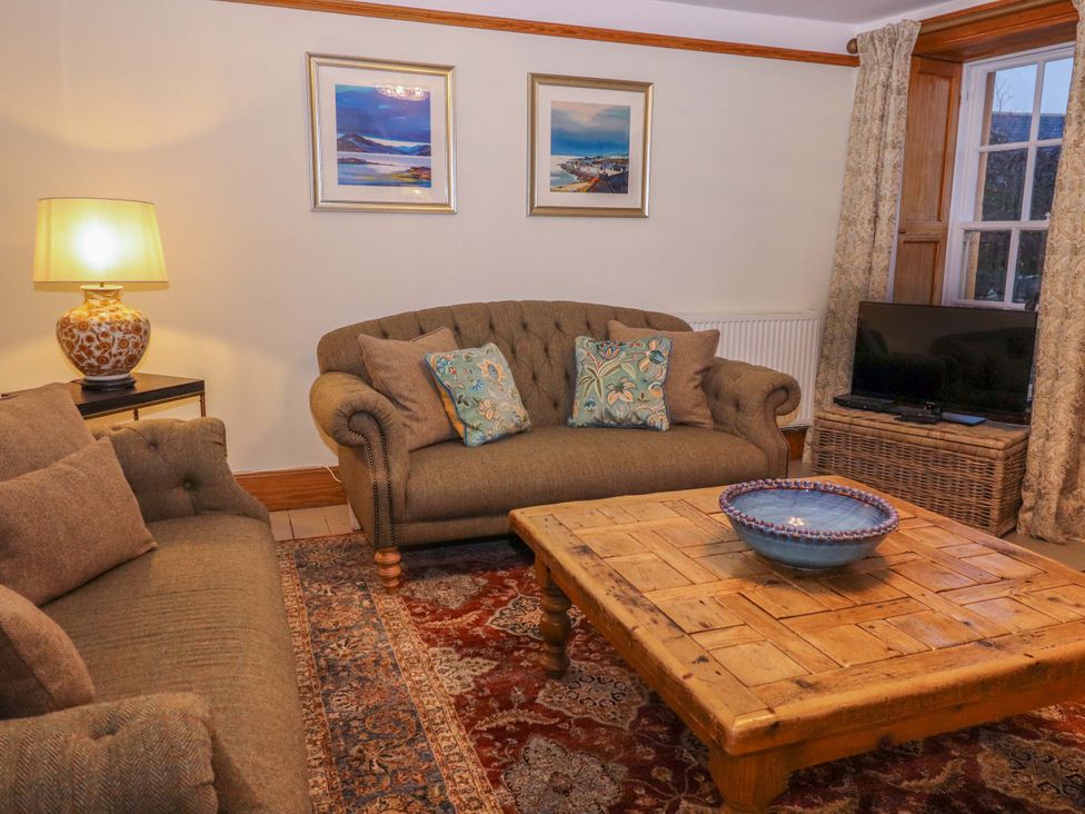 A living room with a sofa and coffee table at Paye House - Cromarty