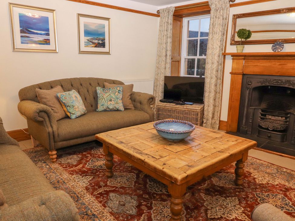 A living room with a sofa and coffee table at Paye House - Cromarty