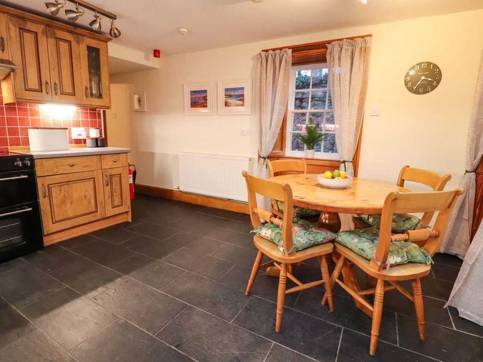 A kitchen with a table and chairs at Paye House - Cromarty