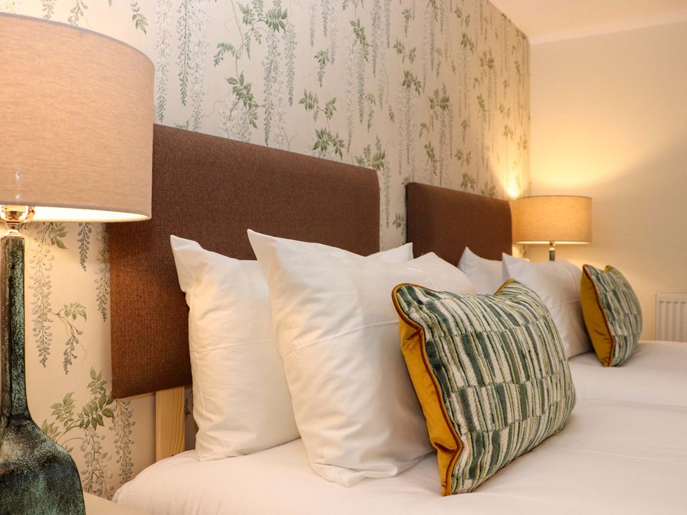 Two beds with headboards and pillows at Paye House - Cromarty