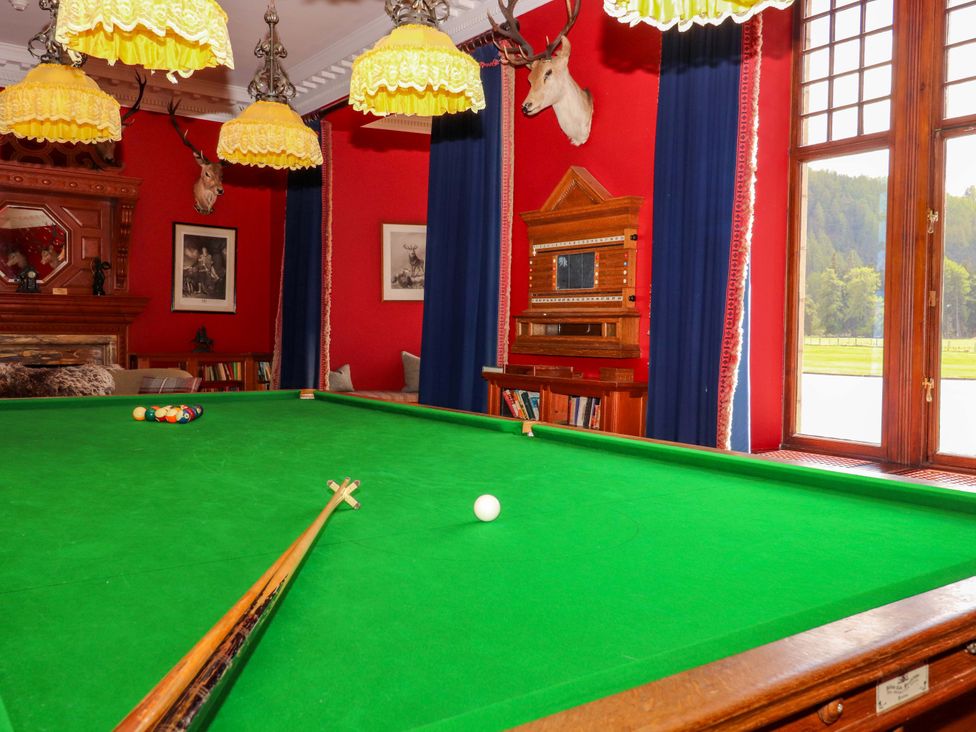 A game room with a pool table and a window at Paye House - Cromarty
