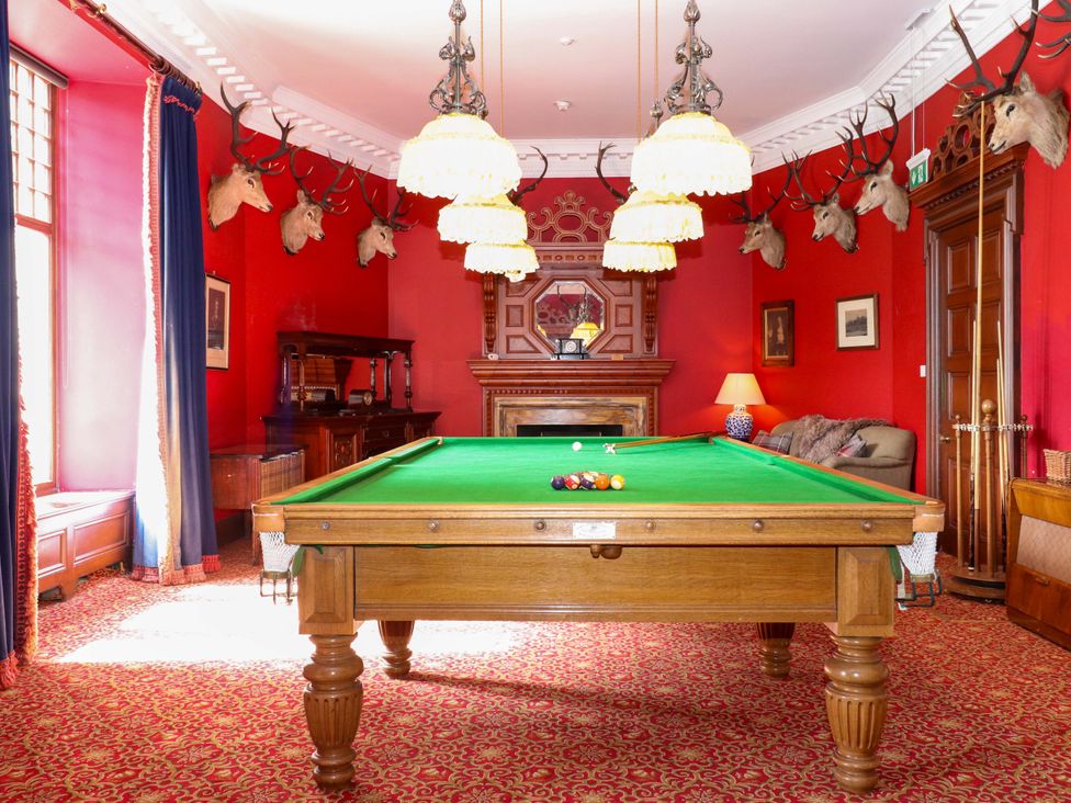A snug with billiard table and fireplace at Paye House - Cromarty