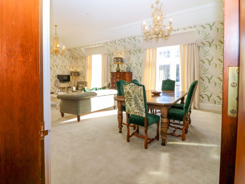 A dining room with a table and chairs at Braeriach - Mar Lodge Estate, Braemar