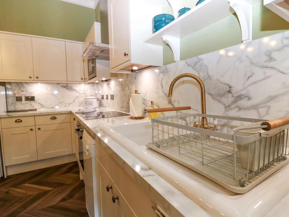 A kitchen with a sink and dish rack at Braeriach - Mar Lodge Estate, Braemar