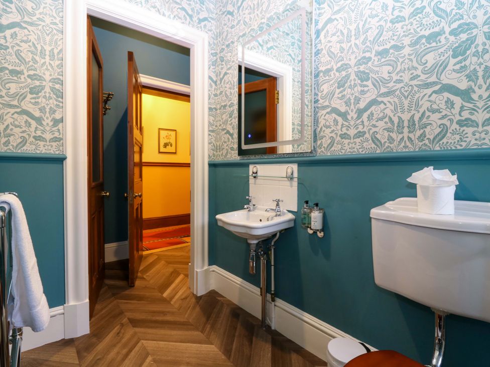 A bathroom with a sink and toilet at Braeriach - Mar Lodge Estate in Braemar