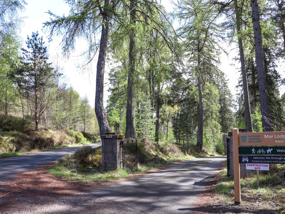 A sign and gate marking the entrance to Mar Lodge Estate in Braemar
