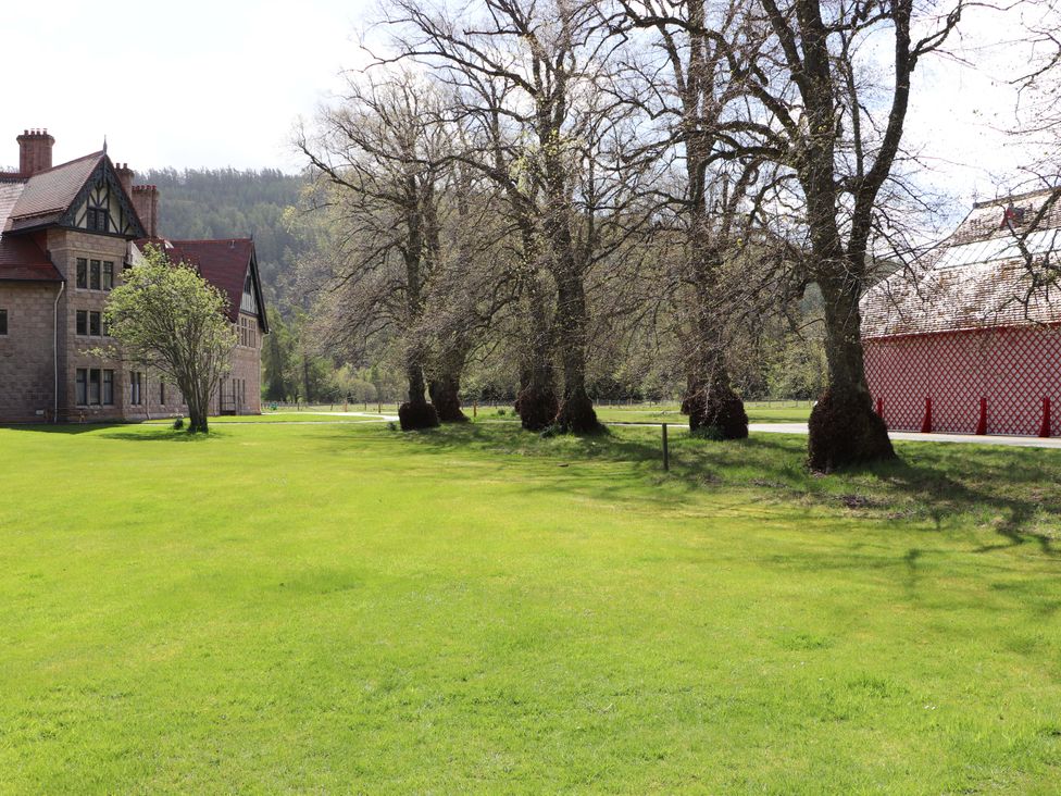 A large outdoor area with a building and trees at Dalvorar - Mar Lodge Estate in Braemar