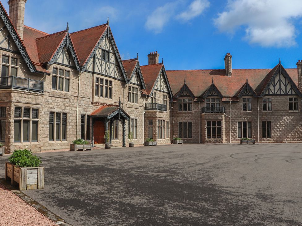An exterior view of a house with a driveway at Derry - Mar Lodge Estate in Braemar