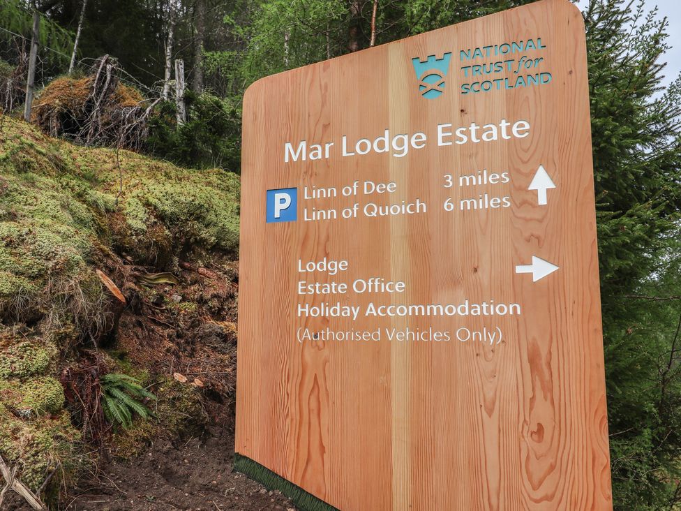 A sign indicating directions at Mar Lodge Estate near Braemar