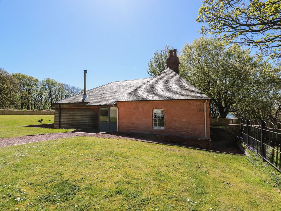 A house with a chimney in an outdoor area at Ardlochan Lodge - Culzean Castle in Maybole