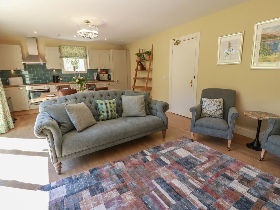 A living room with a sofa and armchairs at Ardlochan Lodge - Culzean Castle in Maybole