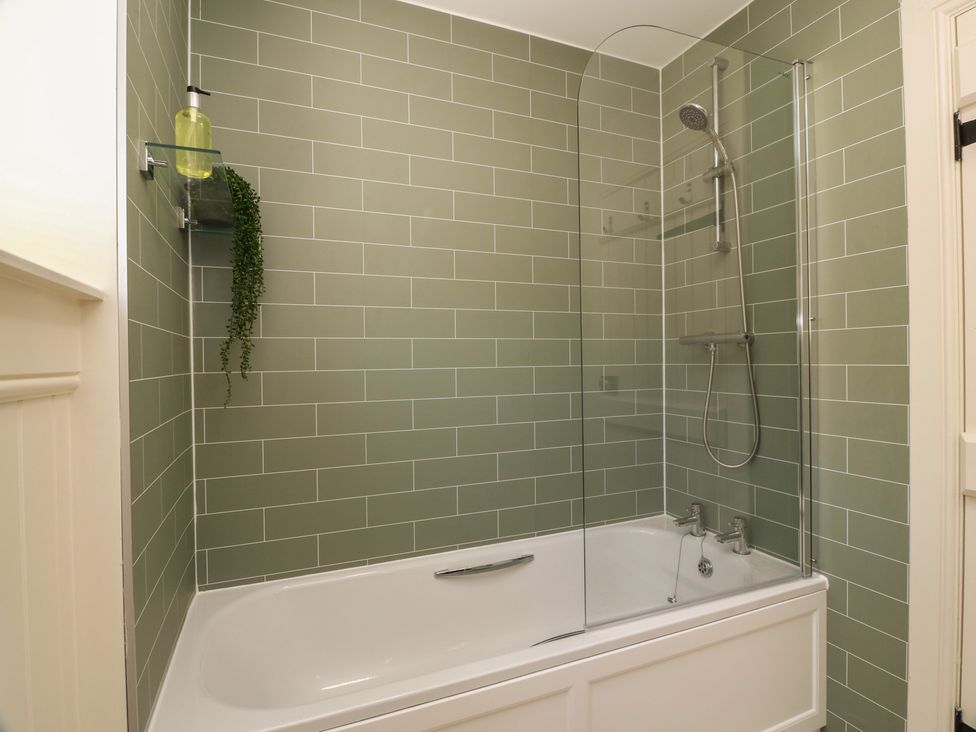 A bathroom with a bathtub and shower setup at Ardlochan Lodge - Culzean Castle, Maybole