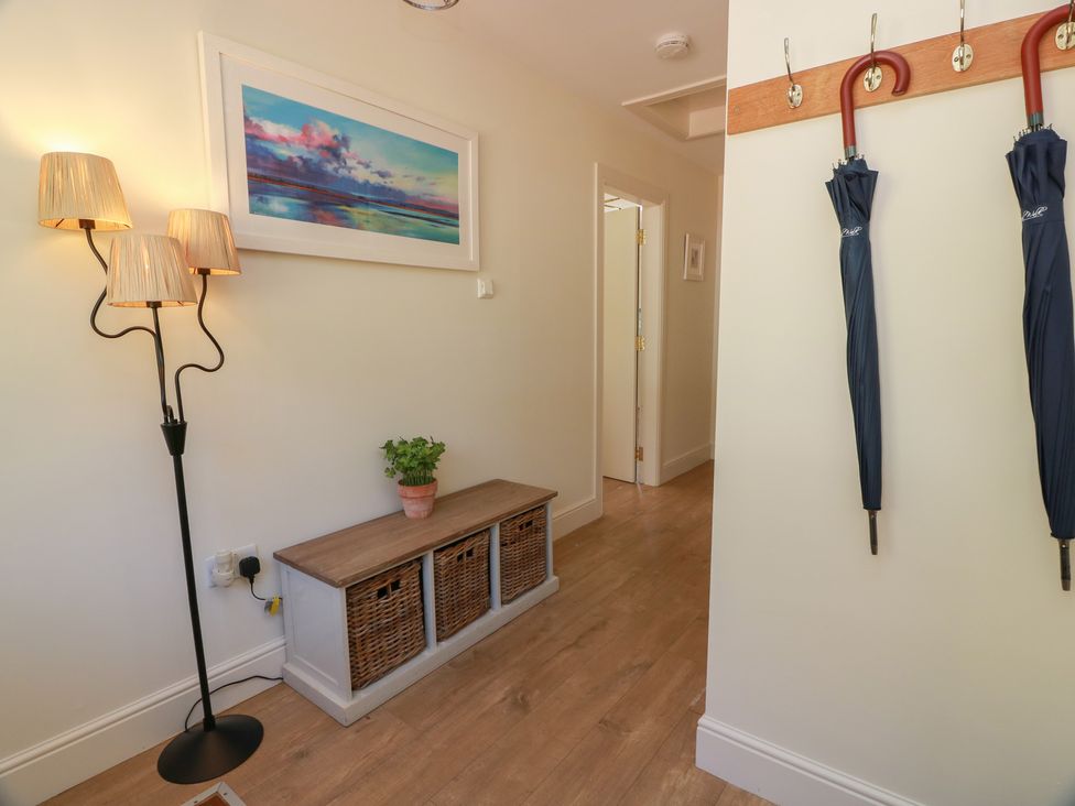 A hallway with a lamp and storage unit at Ardlochan Lodge - Culzean Castle in Maybole