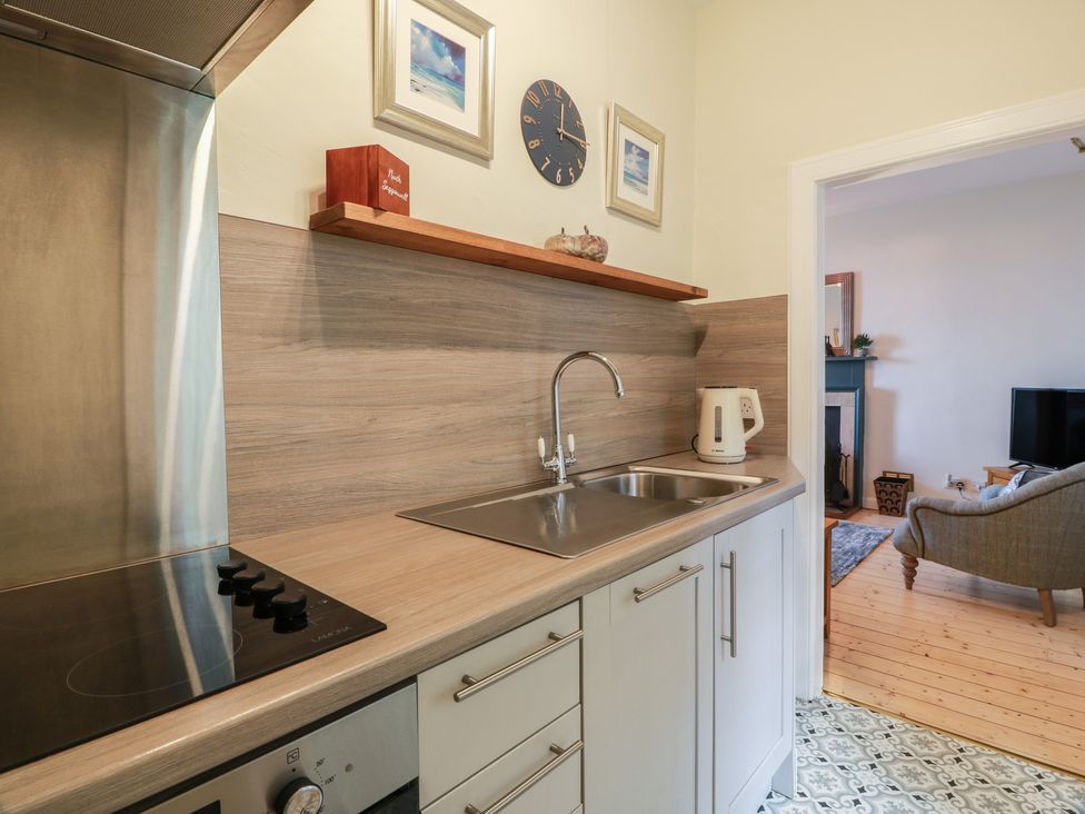 A kitchen with a sink and stove at North Segganwell - Culzean Castle Maybole