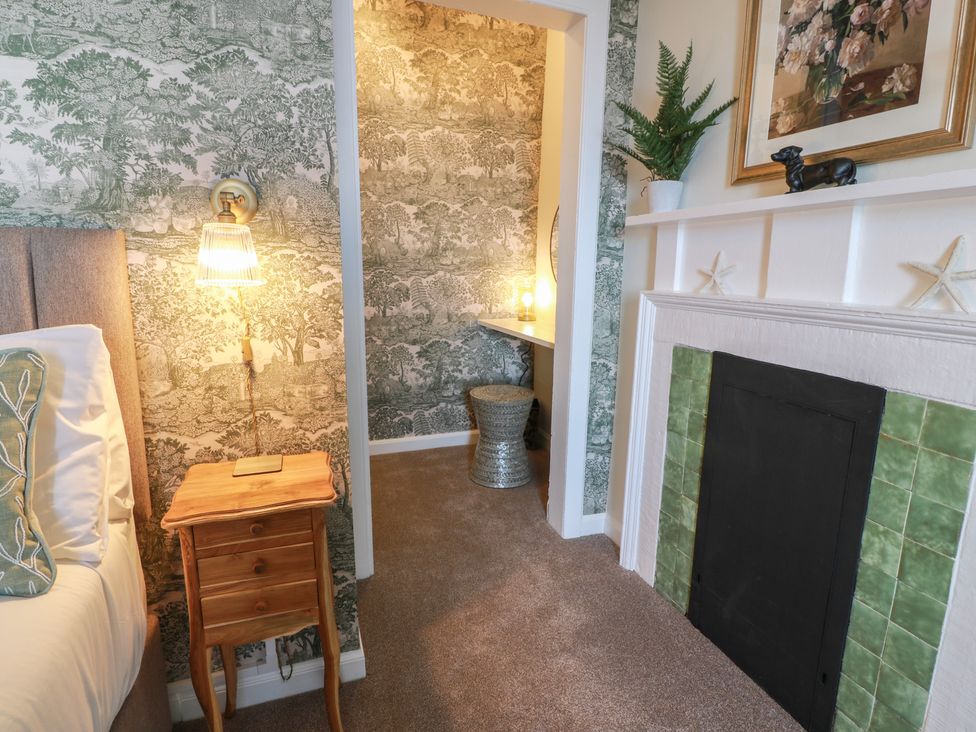 A bedroom with a bed and lamp at North Segganwell - Culzean Castle in Maybole