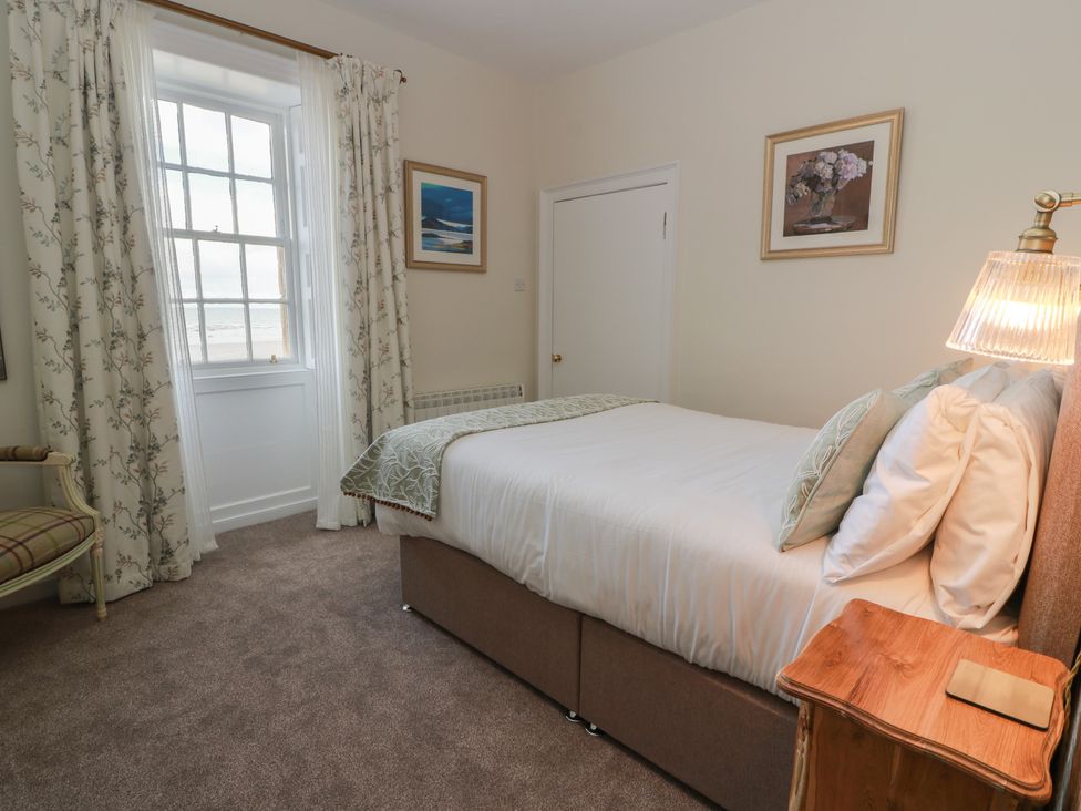 A bedroom with a bed and window at North Segganwell - Culzean Castle Maybole