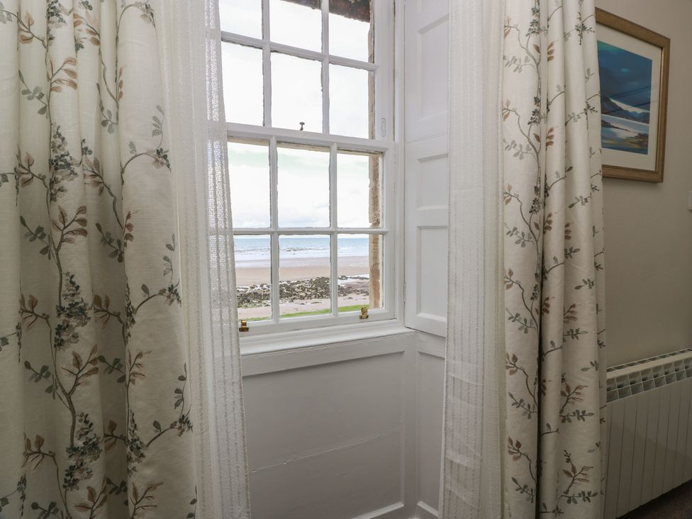 A window with curtains in a room at North Segganwell - Culzean Castle Maybole