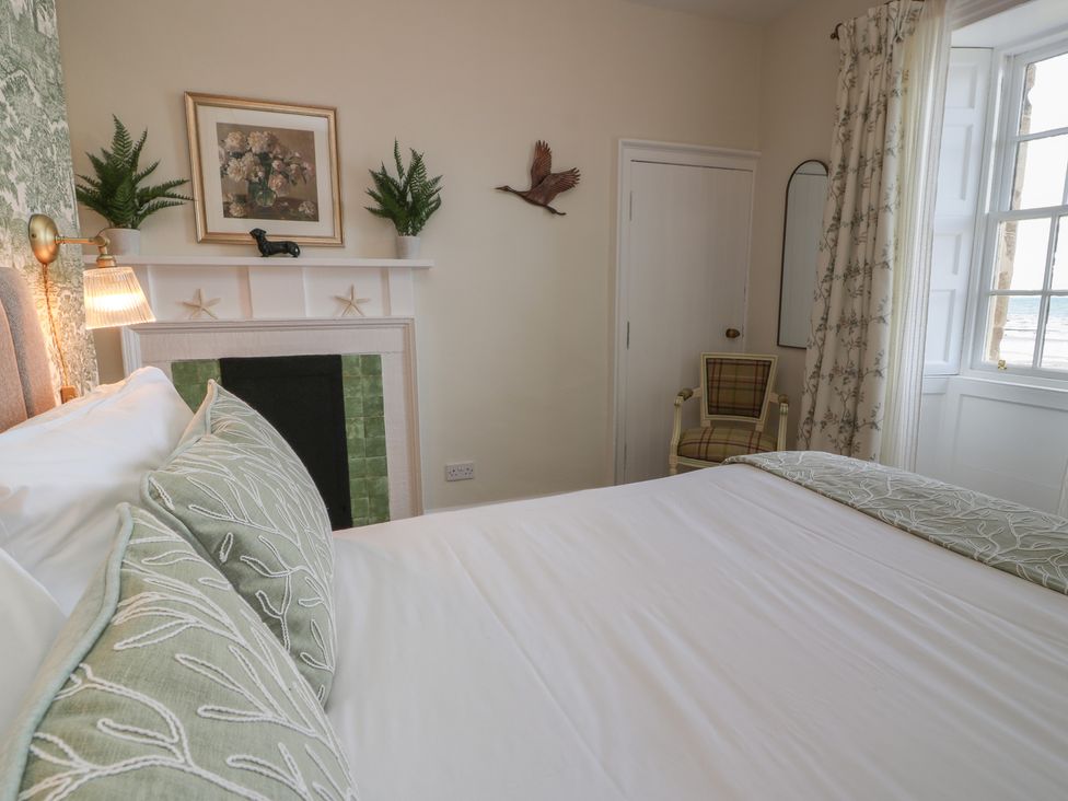 A bedroom with a bed and a chair at North Segganwell - Culzean Castle, Maybole