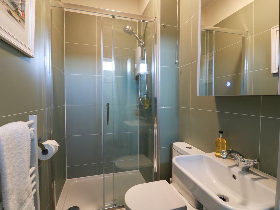 A bathroom with a shower and sink at North Segganwell - Culzean Castle, Maybole