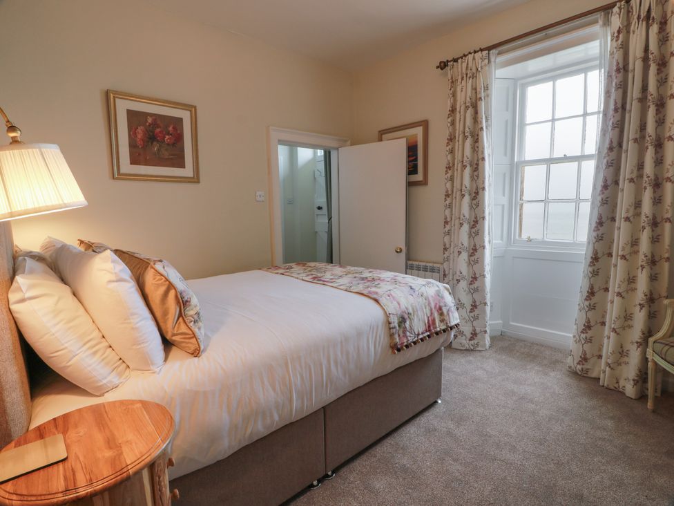 A bedroom with a bed and a window at South Segganwell - Culzean Castle, Maybole