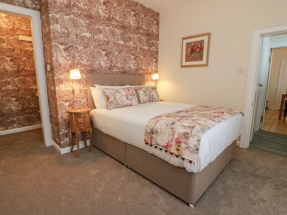 A bedroom with a bed and bedside table at South Segganwell - Culzean Castle Maybole