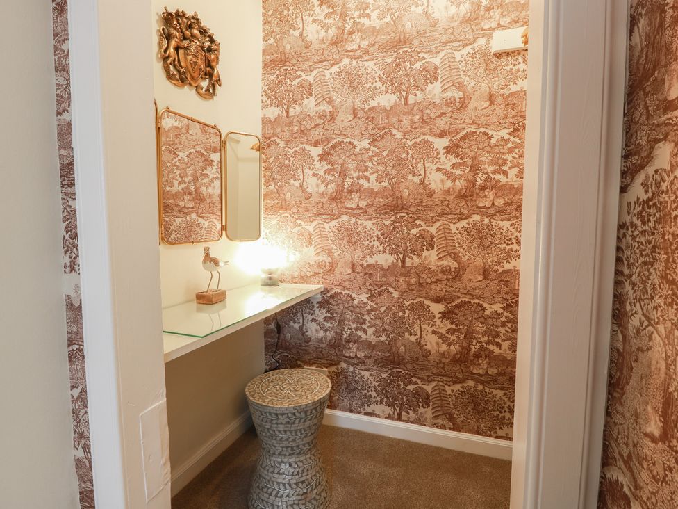A dressing room with a mirror and table at South Segganwell - Culzean Castle Maybole