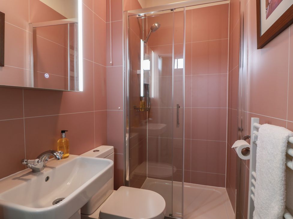 A bathroom with a sink and shower at South Segganwell - Culzean Castle in Maybole