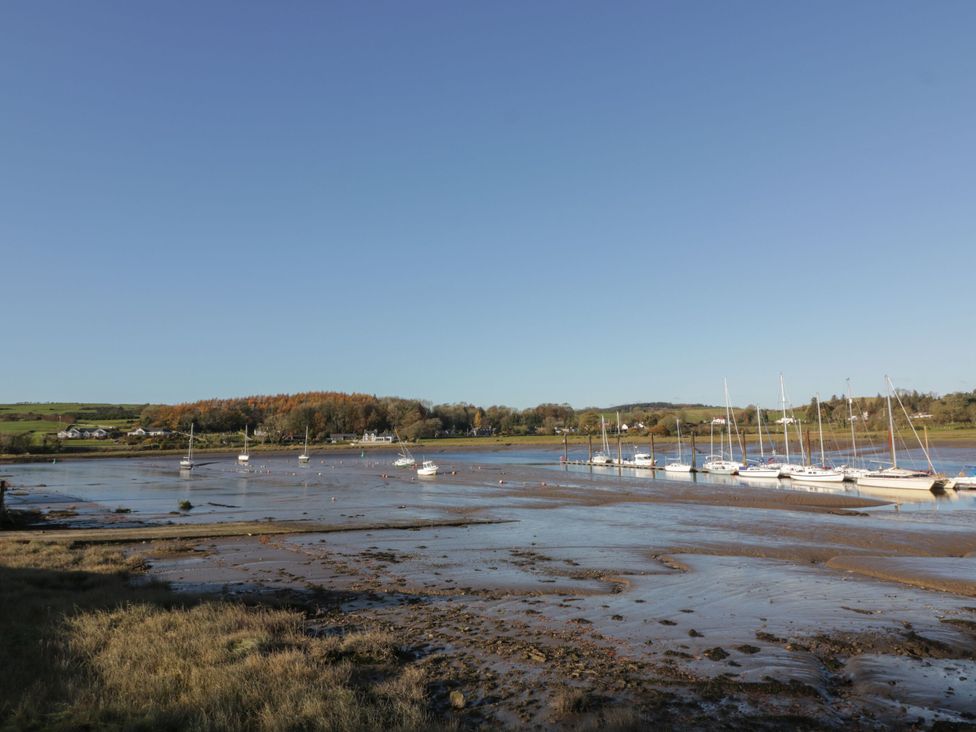 A view of boats on a muddy shore at Blue Door - Kirkcudbright