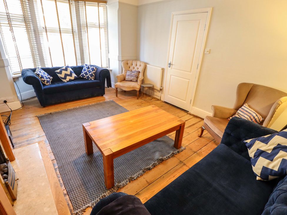 A living room with sofas and a coffee table at Maples in Hunstanton