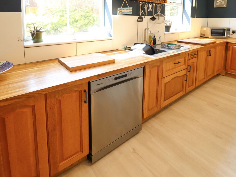 A kitchen with a sink and dishwasher at Maples in Hunstanton