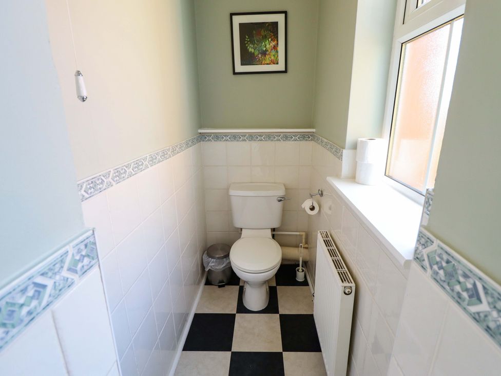 A bathroom with a toilet and sink at Maples in Hunstanton