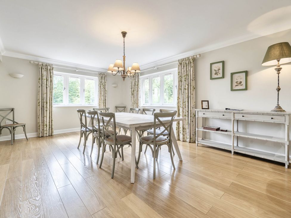 A dining room with a table and chairs at Cunsey Lodge at the Graythwaite Estate near Hawkshead