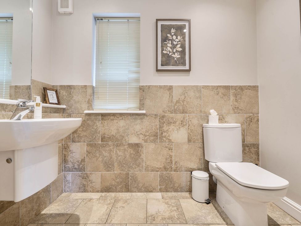A bathroom with a sink and toilet at Cunsey Lodge at the Graythwaite Estate