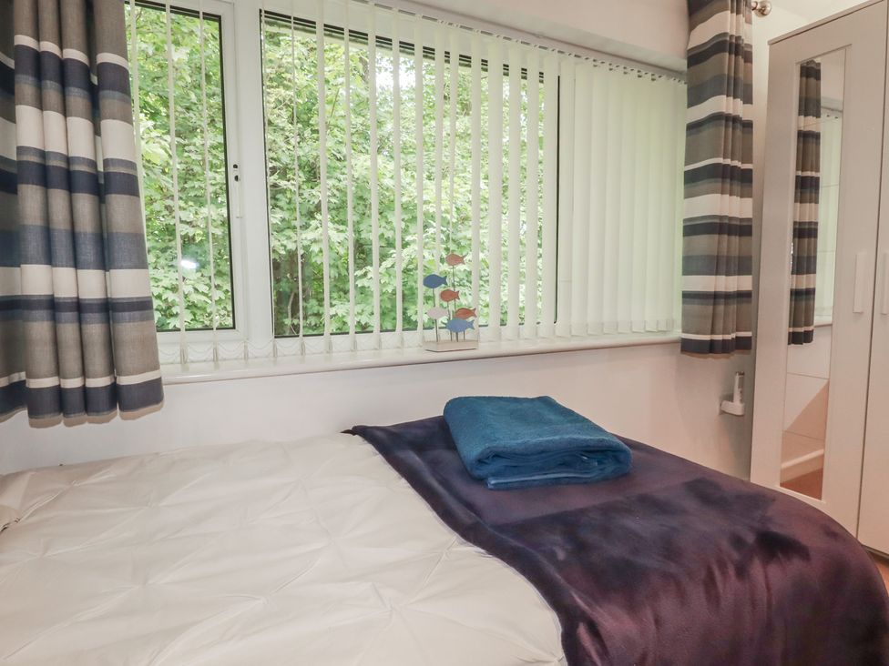 A bedroom with a bed and towel on it at 49 Atlantic Reach Newquay