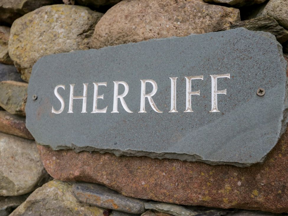 A sign on a stone wall at Sherriff in Troutbeck, near Keswick