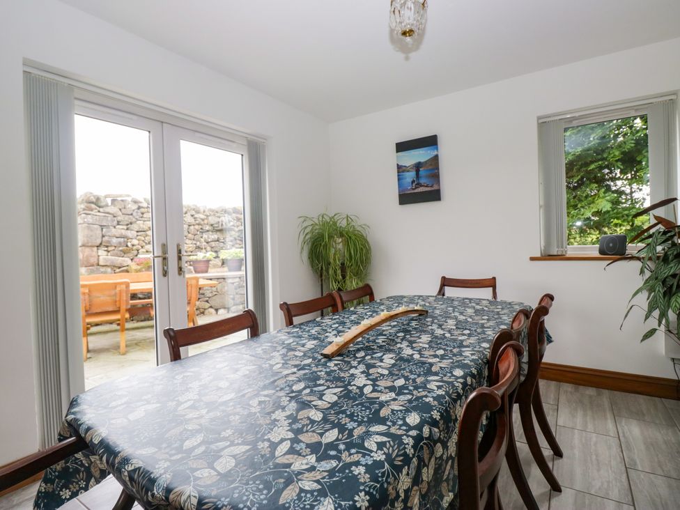 A dining room with a table and chairs at Sherriff in Troutbeck, near Keswick