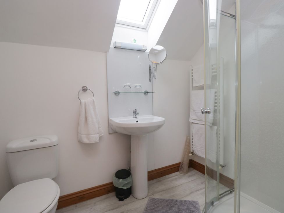 A bathroom with a sink, shower and toilet at Sherriff, Troutbeck, near Keswick