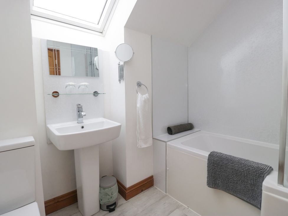 A bathroom with sink and bathtub at Sherriff, Troutbeck, near Keswick