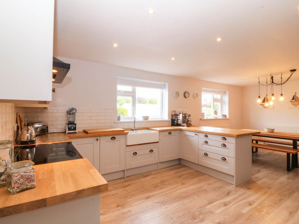 A kitchen with wooden counters and a coffee machine at Afallon in Llanbedrog