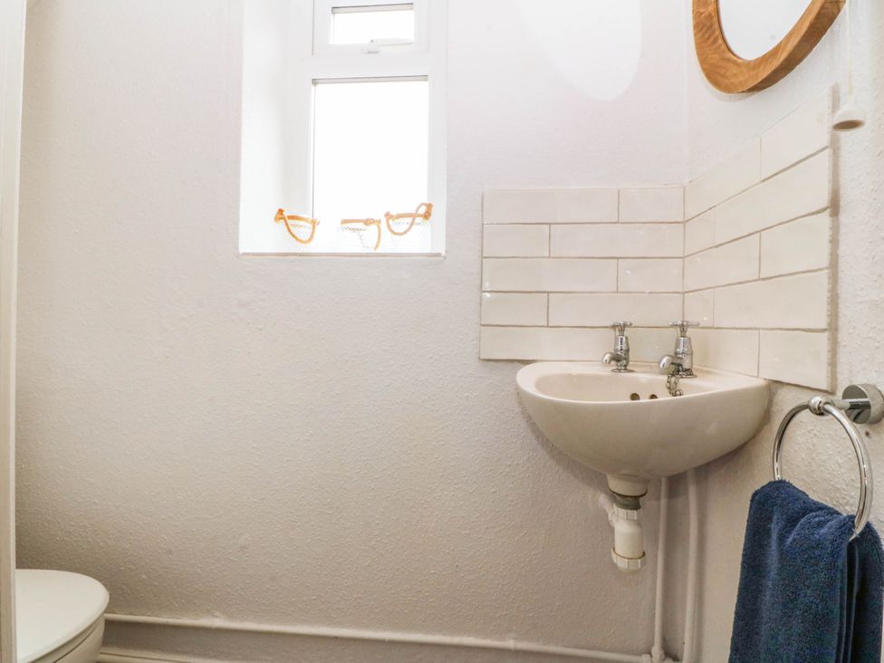 A bathroom with a sink and toilet at Afallon in Llanbedrog