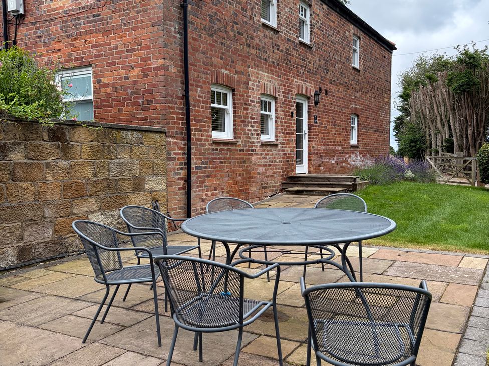 A garden with a table and chairs at Beechwood Cottage Easby near Great Ayton