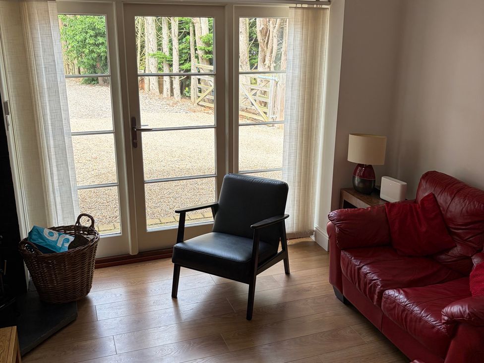 A living room with a chair and sofa at Beechwood Cottage Easby near Great Ayton