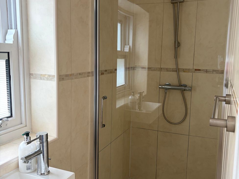 A bathroom with a shower and sink at Beechwood Cottage in Easby near Great Ayton