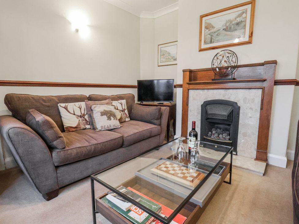 A living room with a sofa and fireplace at Beachcrest in Whitby