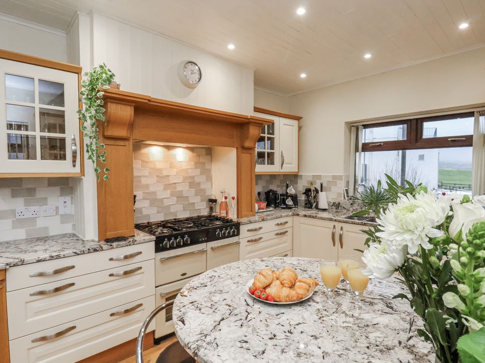 A kitchen with a stove and countertop at Beachcrest in Whitby