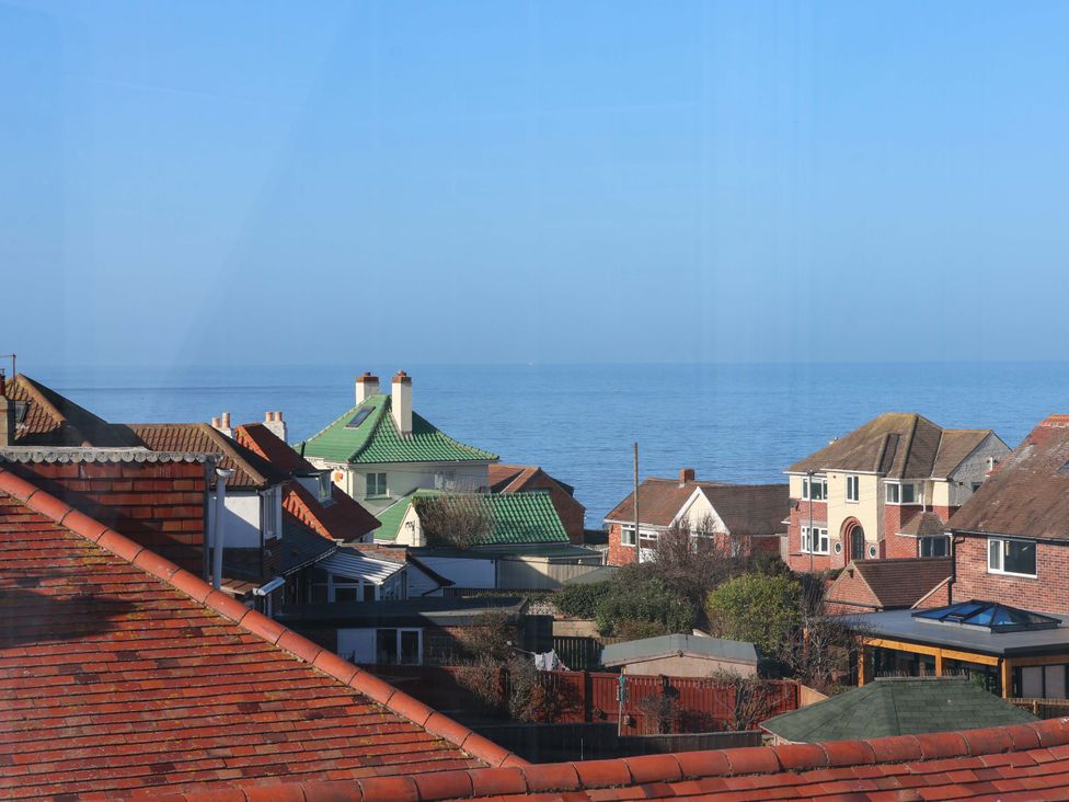 A view of rooftops and the sea at Beachcrest in Whitby