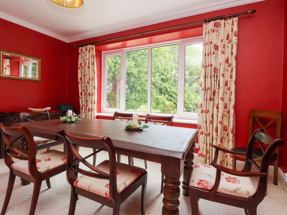 A dining room with a table and chairs at Raincliffe Manor in Scarborough