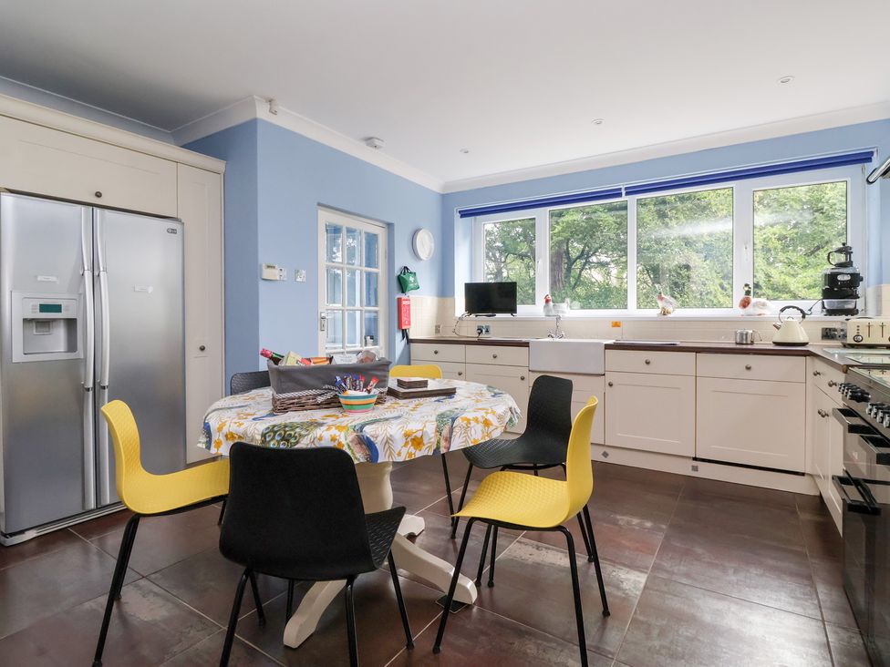 A kitchen with a table and chairs at Raincliffe Manor in Scarborough